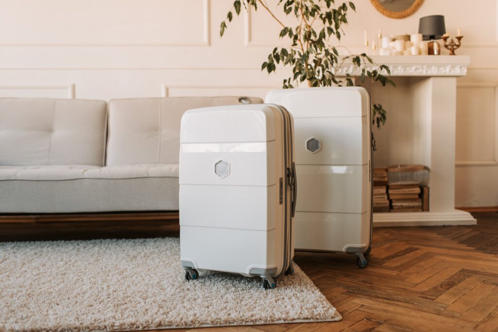 Two Suit Cases Sitting On The Floor for travel